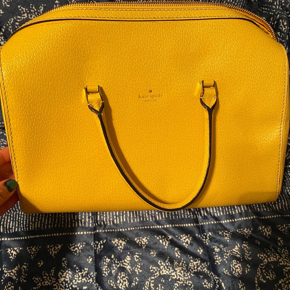 Yellow rounded kate spade handbag